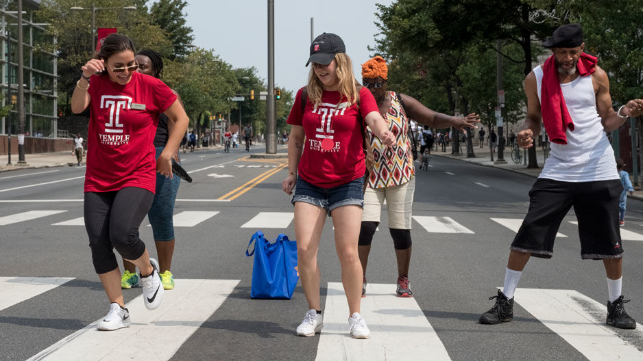 A group of people dancing on Broad Street