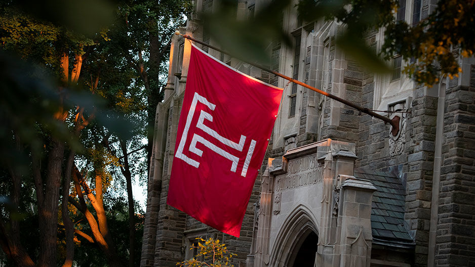 A red flag with a Temple "T" affixed to Sullivan Hall