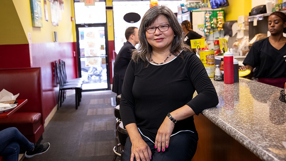 Shirley Moy sitting at a diner counter