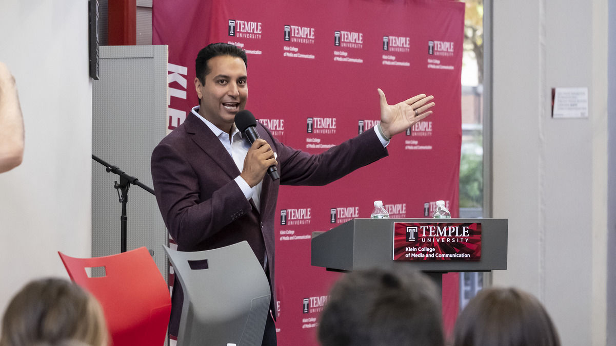 Image of Kevin Negandhi speaking at a summit event on Main Campus.