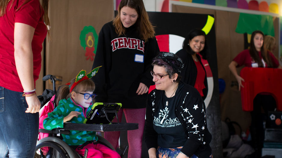 a student using an adaptive device