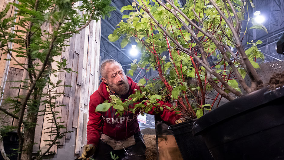 Michael LoFurno working on Flower Show exhibit