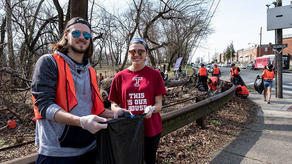 James Maguire and Meara Kuhfahl at a park cleanup