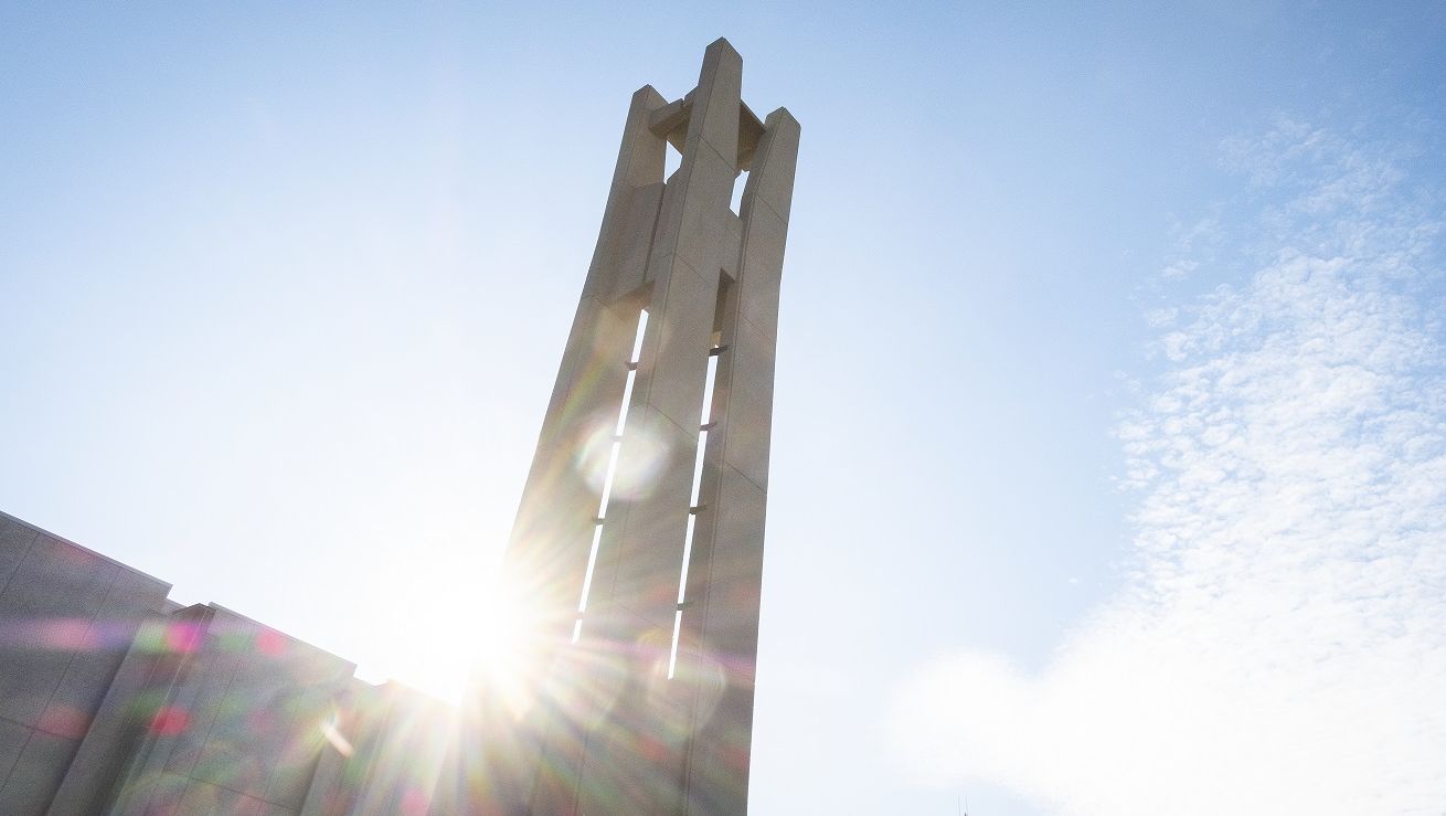 A sunbeam shining behind the Bell Tower.