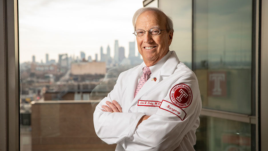 Dean Daly smiling in his white coat