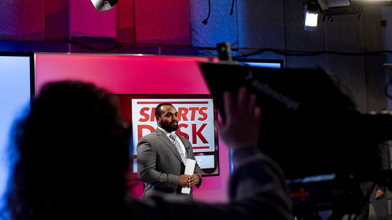 a student on the set of Sports Desk