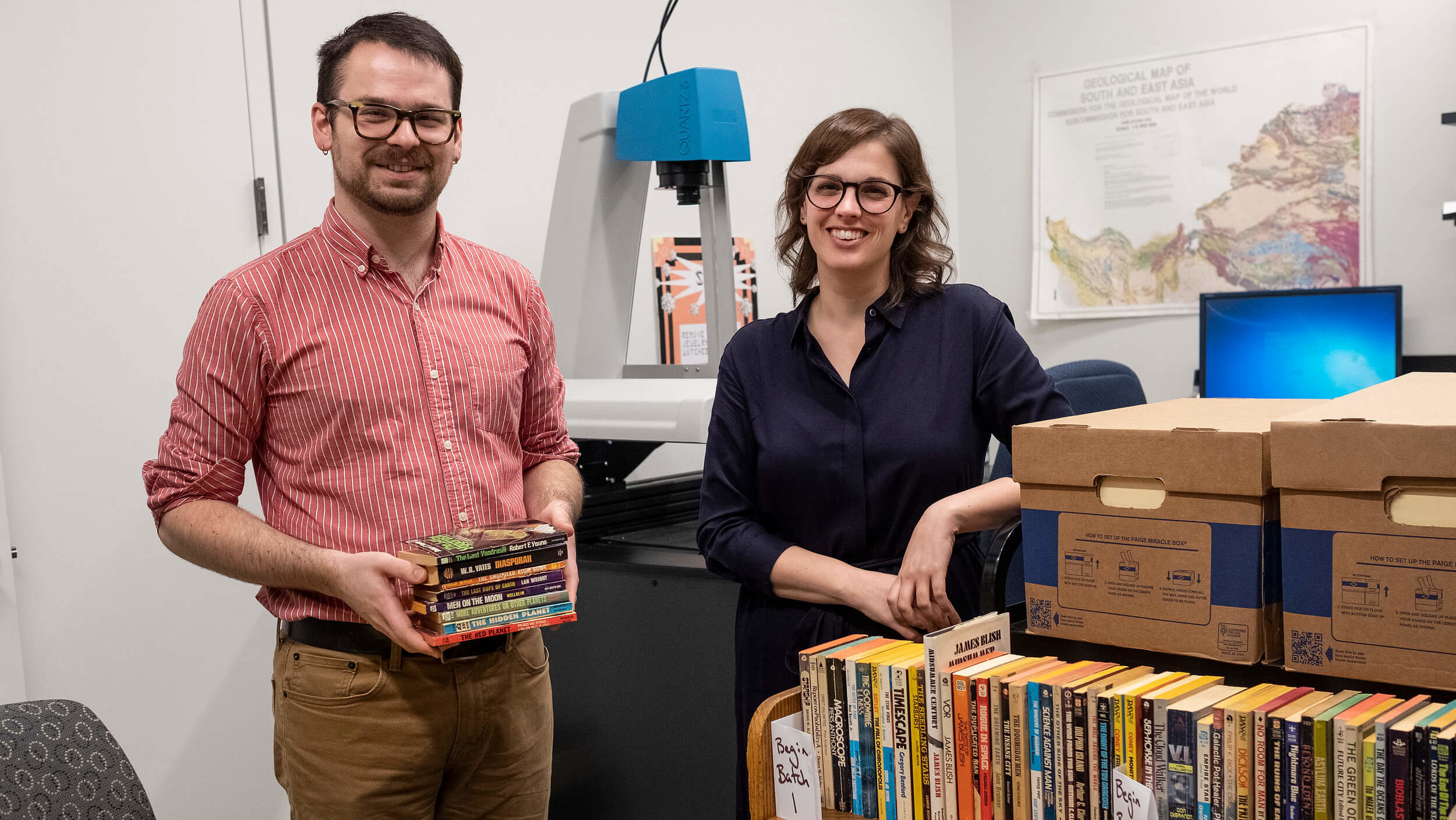 Librarians Michael Carroll and Stefanie Ramsay are part of a team at Temple Libraries digitizing science fiction books.
