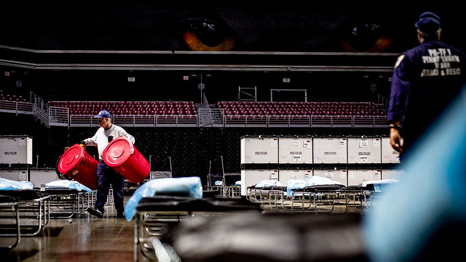 Emergency responders set up a field hospital in the Liacouras Center in March.