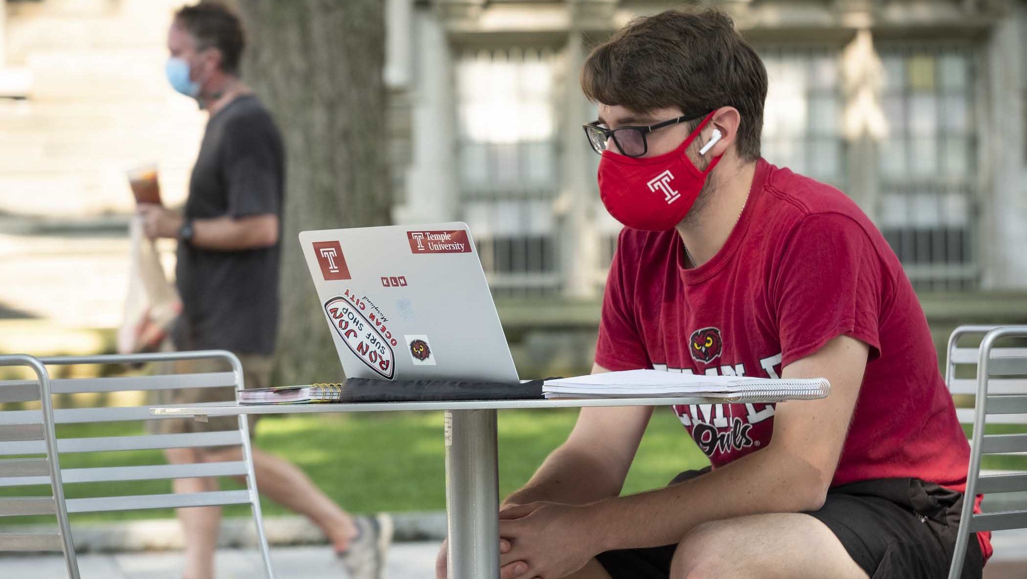 student with a lap top computer