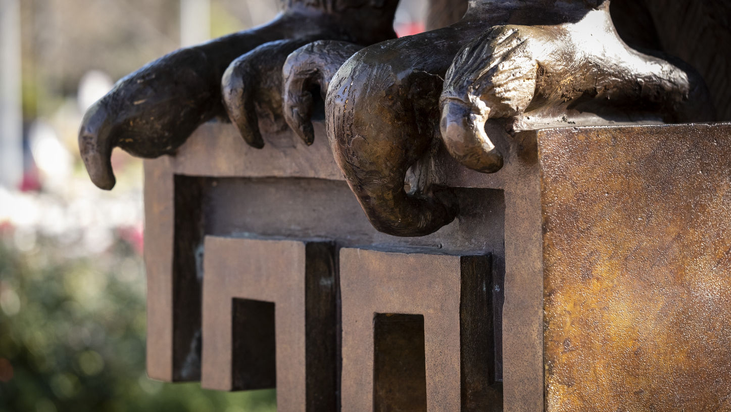 An Owl statue and the Temple T on Main Campus.