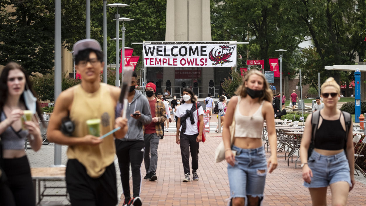 Students walking in front of the Bell Tower on Main Campus.