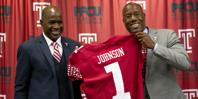 Arthur Johnson pictured with President Wingard, holding Johnson's replica Temple jersey.