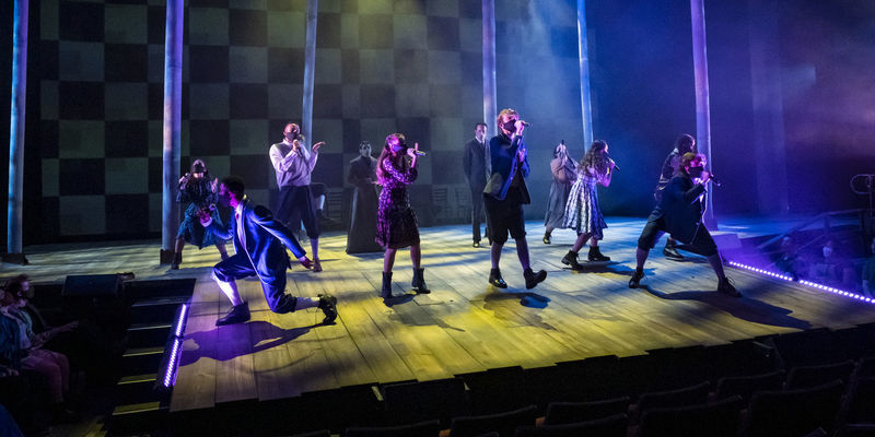 Students sing on stage during a performance of 'Spring Awakening.'