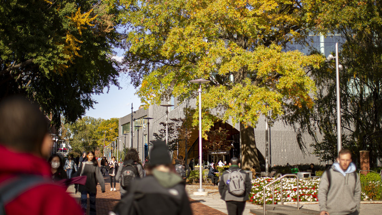 A fall campus stock scene with students walking.