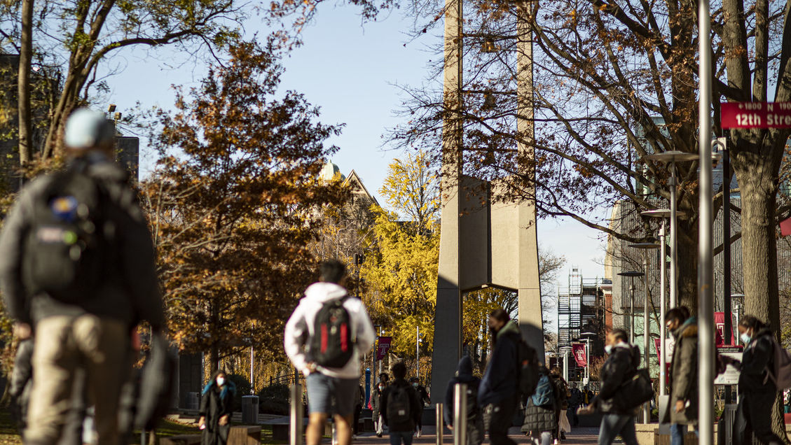 Image of students walking past the Bell Tower on Main Campus.