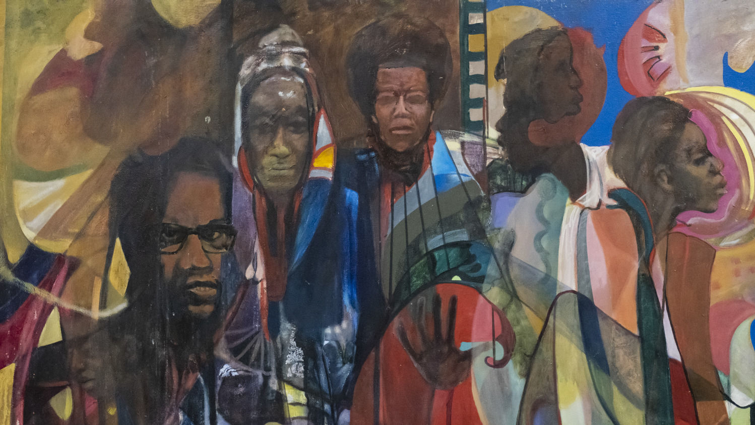 A painting of Black civil rights leaders’ faces with a mixture of cool and warm colors intersecting on top and around each face.