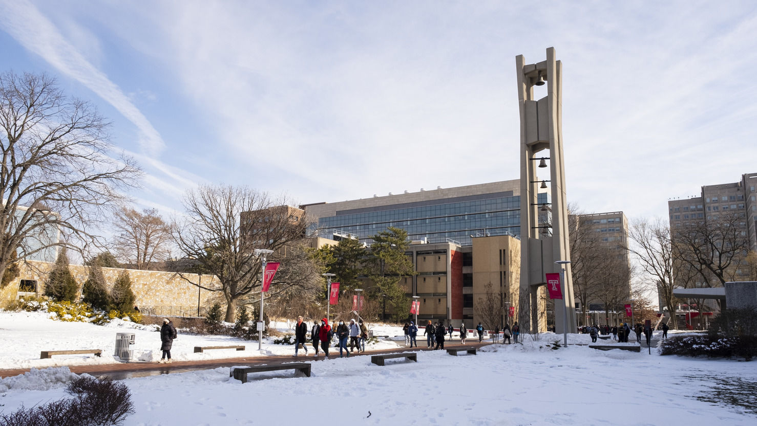  Students walking outside in the snow near the Bell Tower.