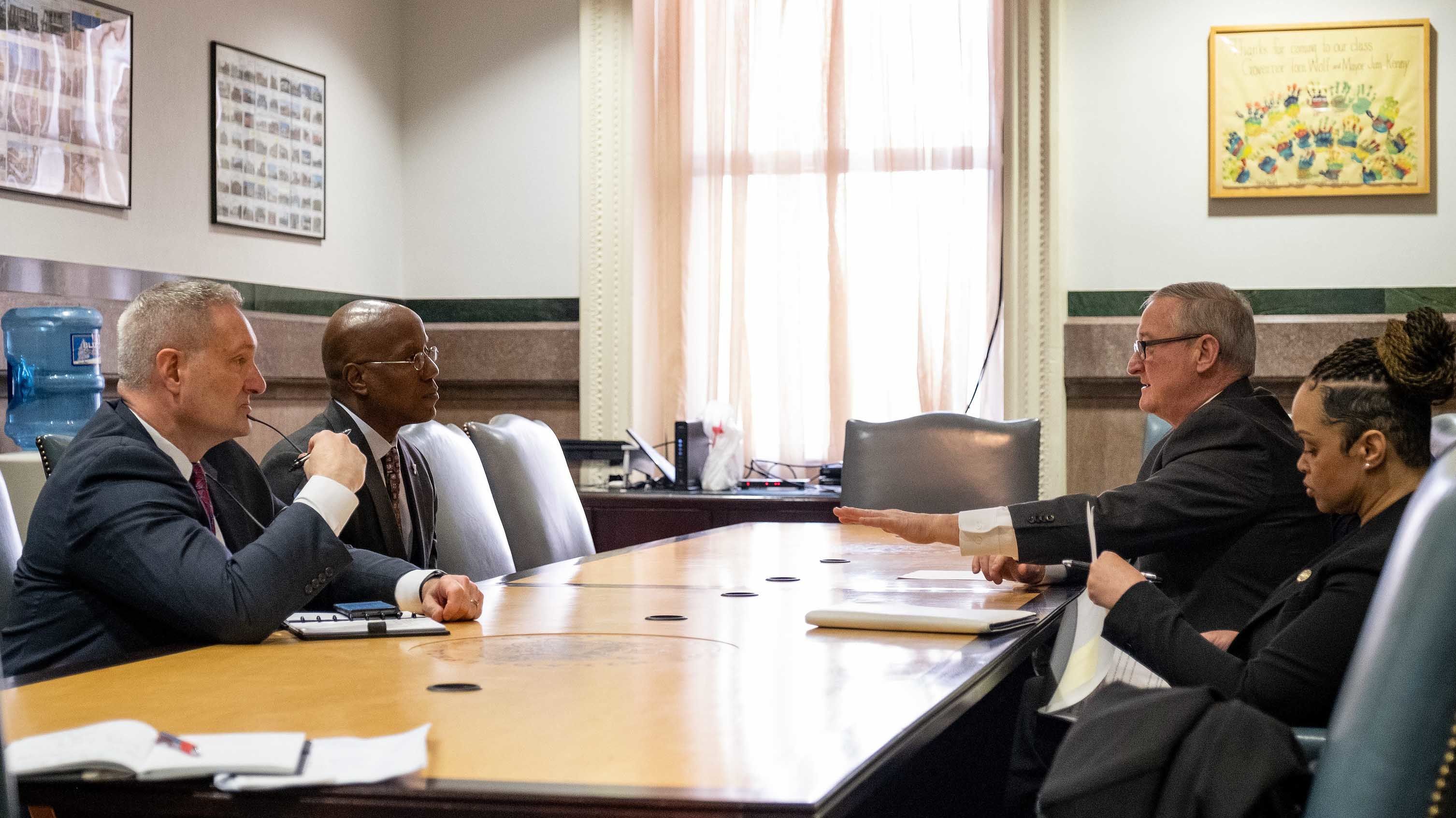 President Wingard at a table with Mayor Kenney and Commissioner Outlaw