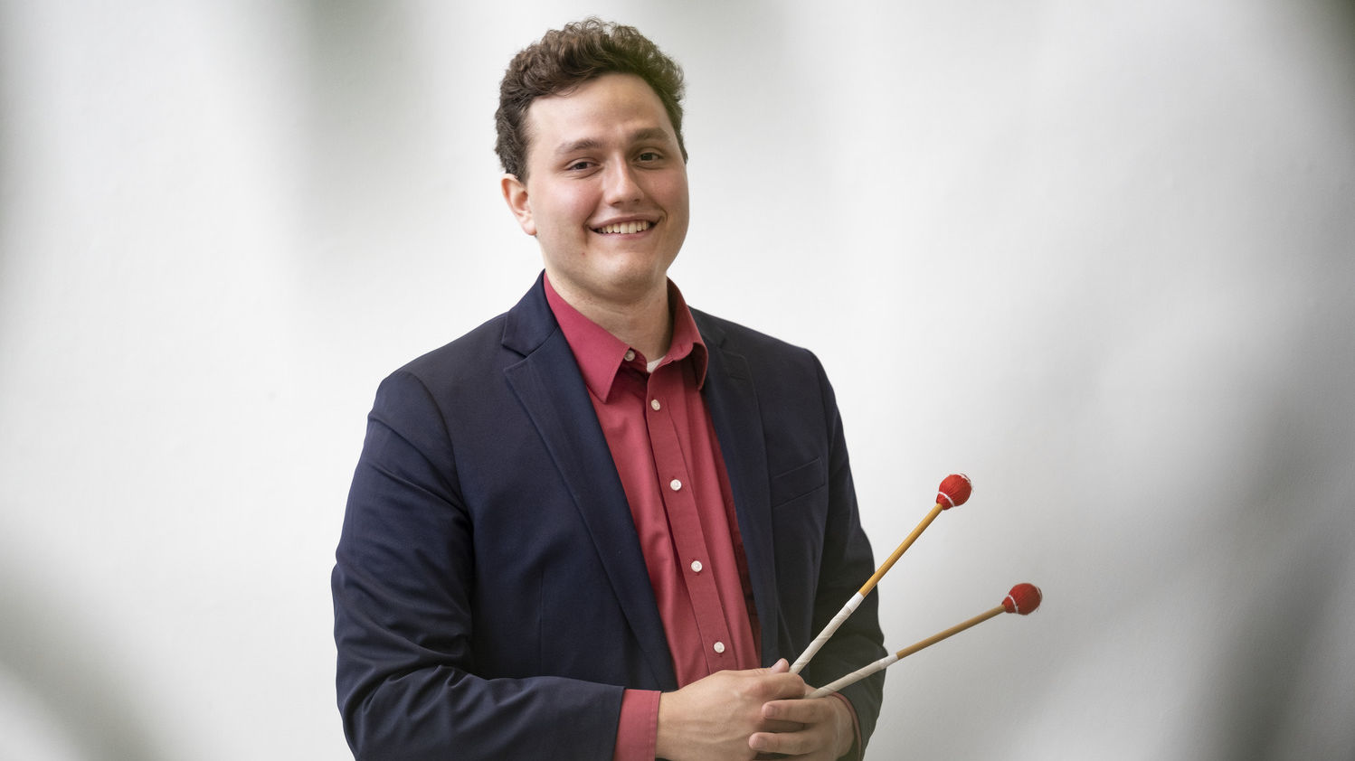 Caleb Breidenbaugh holding a xylophone hammer.