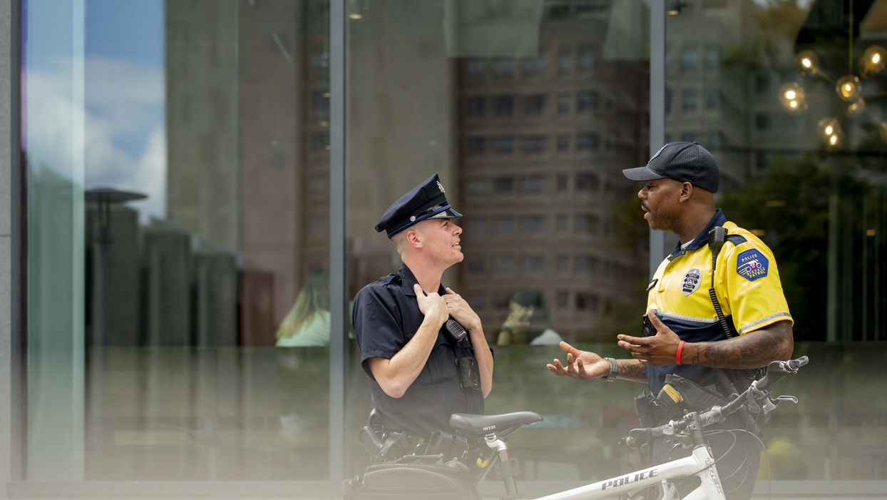 PPD and TUPD police officers talking outdoors