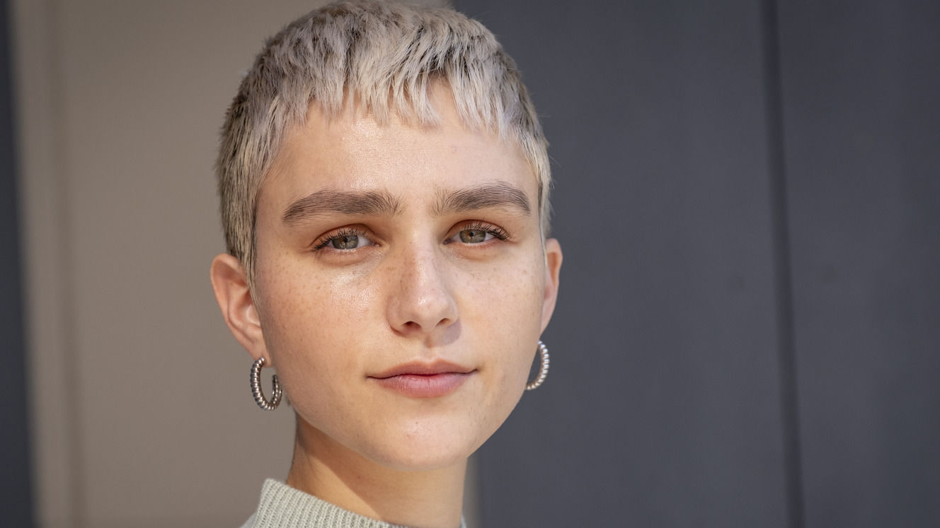 Image of Courtney Kater in a sweater.