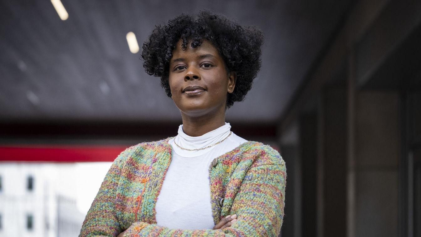 Jazmin Evans standing with her arms crossed on campus 