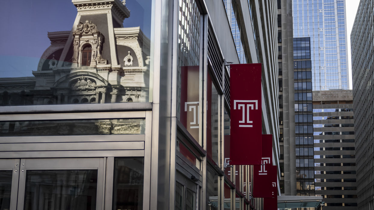 A picture of a Temple flag outside of Temple University Center City.