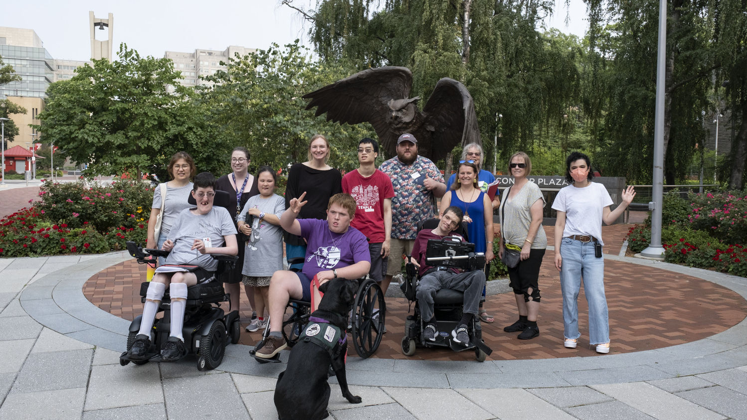 ACES 2023 participants in front of the Owl statue