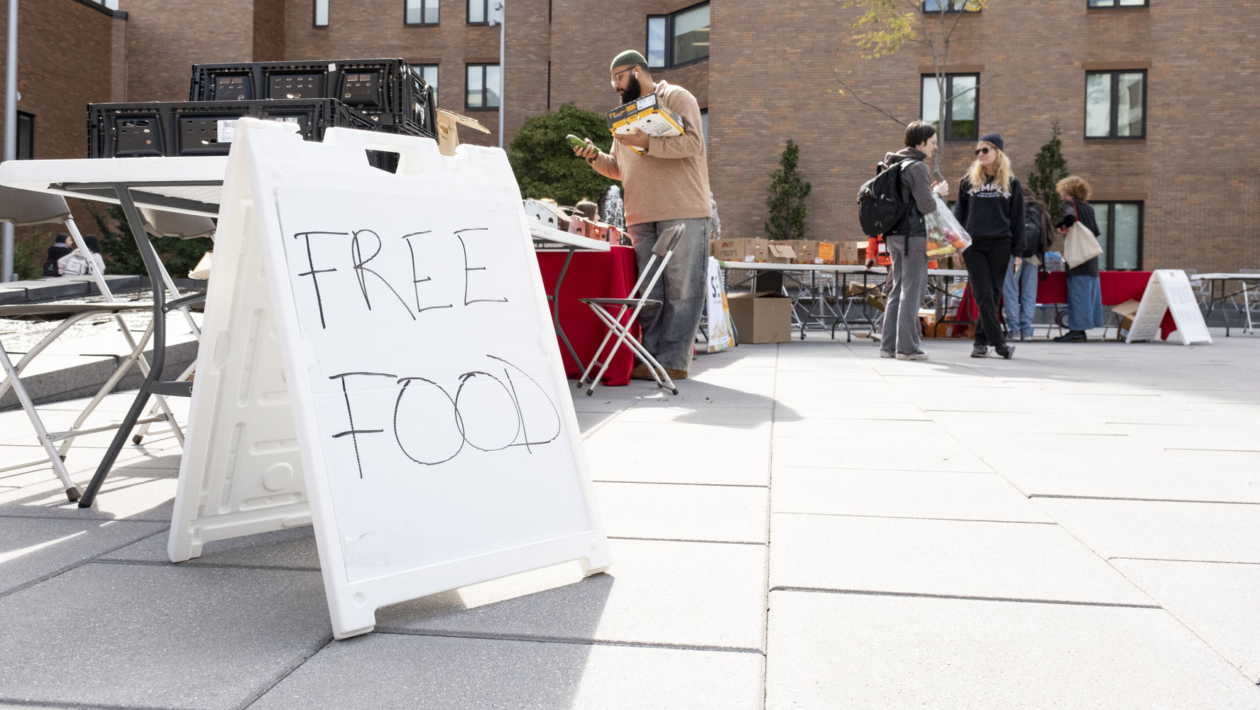 A sign at the World Food Day event reads FREE FOOD 