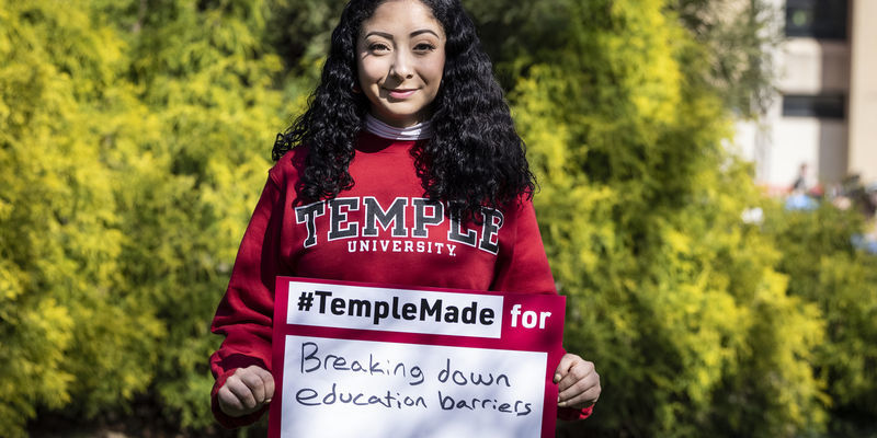 Evelyn Lara holding a Temple Made sign