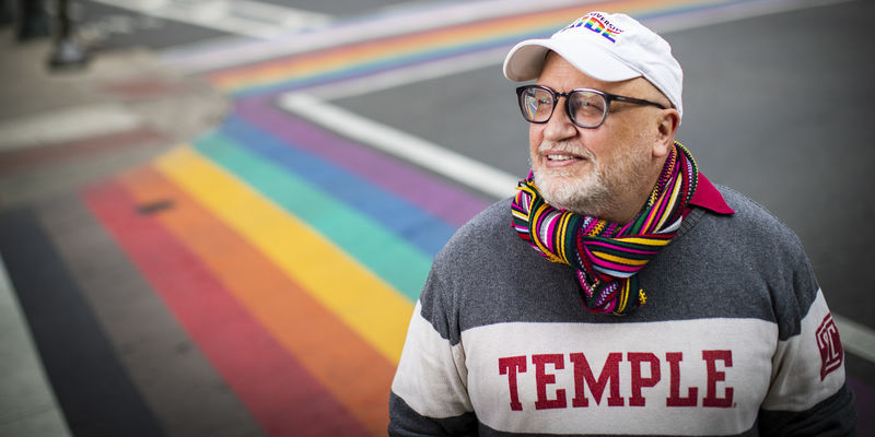 Scott Gratson standing at the rainbow crosswalks on 13th and Locust in Philadelphia