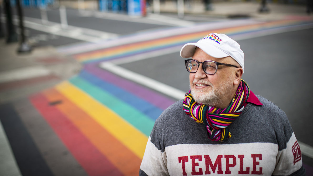 Scott Gratson standing at the rainbow crosswalks on 13th and Locust in Philadelphia