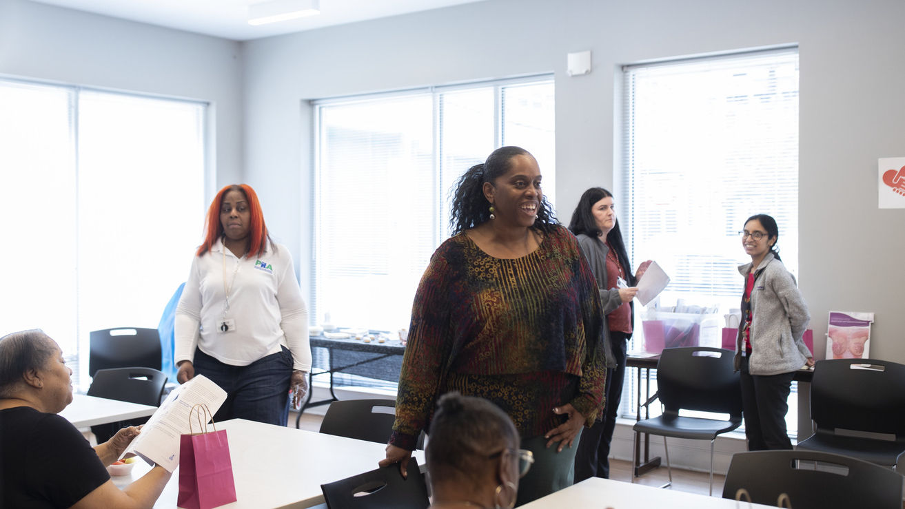 Image of a community health worker at Temple’s breast cancer awareness event.    