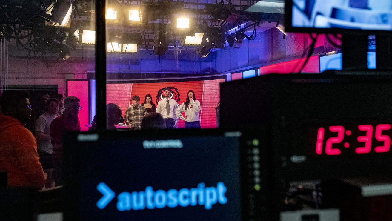 Image of Temple students in the Owl Update studio.