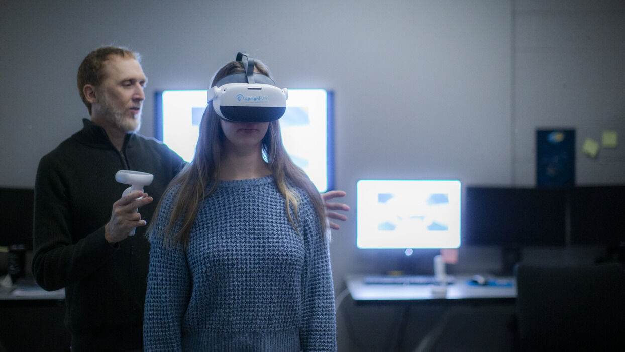W. Geoffrey Wright with a research assistant wearing the UprightVR headset in the Motion-Action-Perception Laboratory 