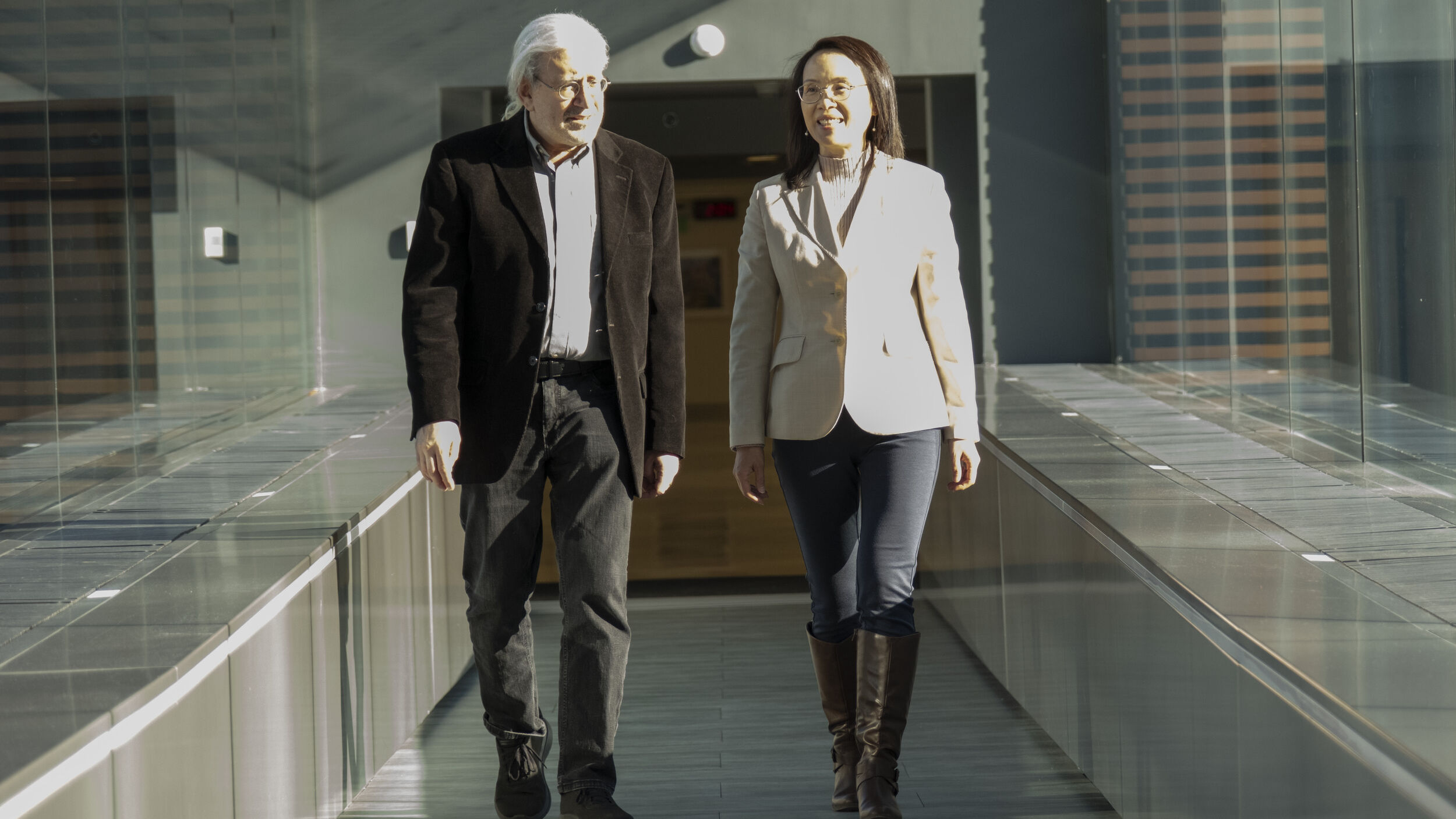 Steve Balsam ad Connie Mao walking in the Skybridge.