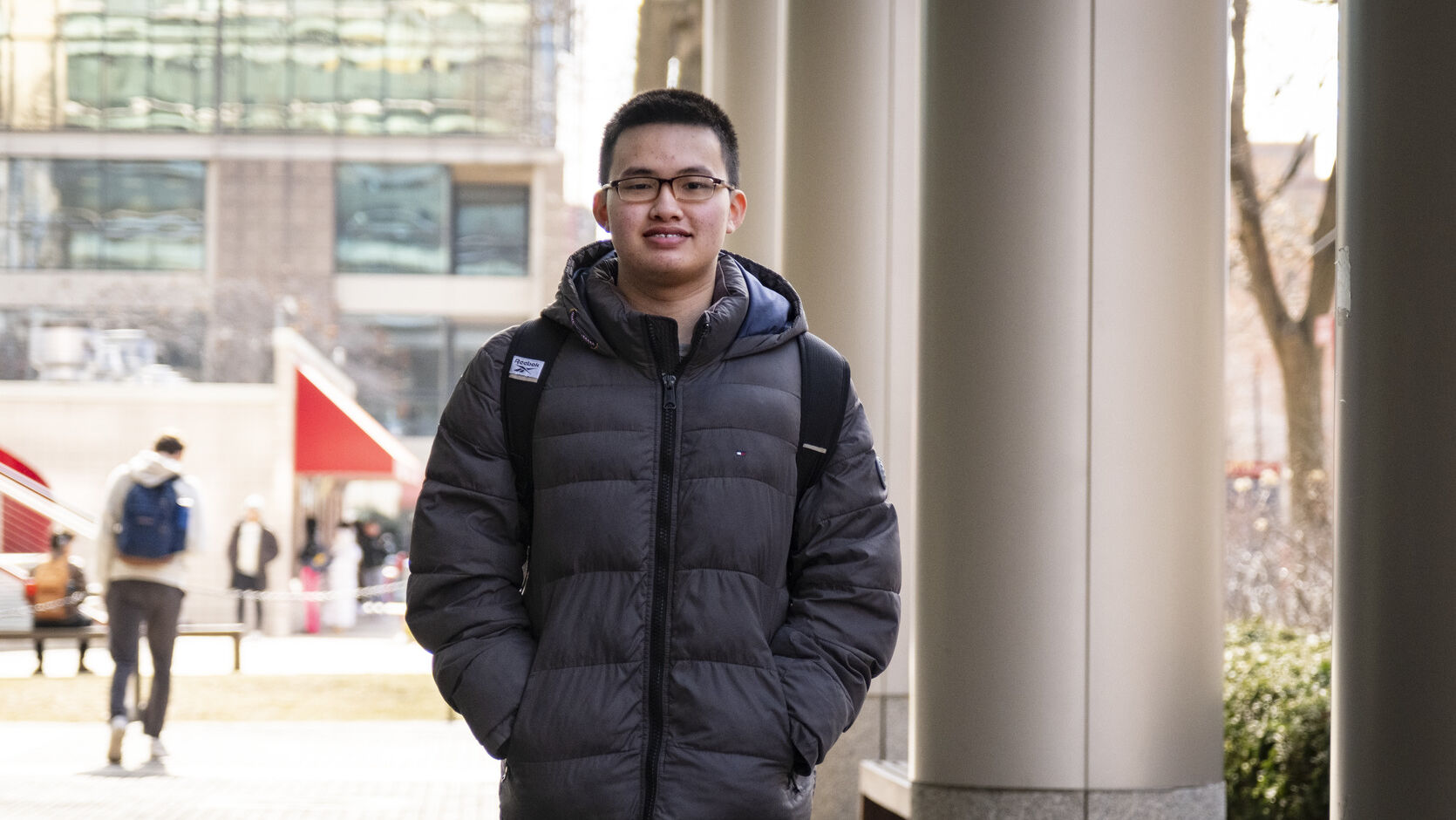 Edmond Tsan walks through campus