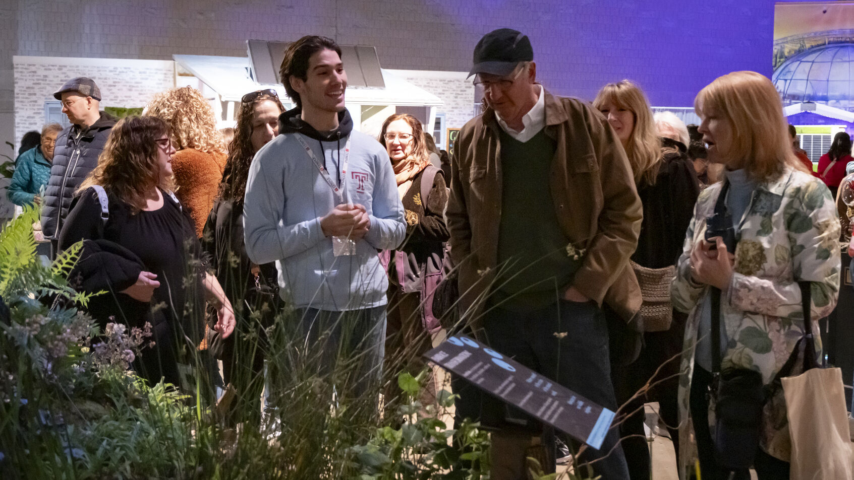 A Temple student presenting the exhibit at the 2025 Philadelphia Flower Show