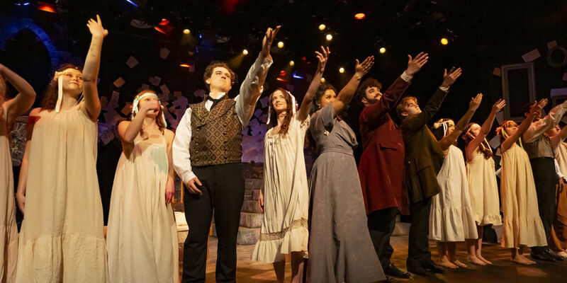 Image of the cast of Goblin Market performing on stage.
