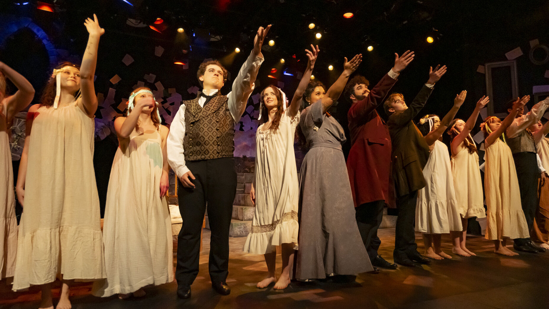 Image of the cast of Goblin Market performing on stage.