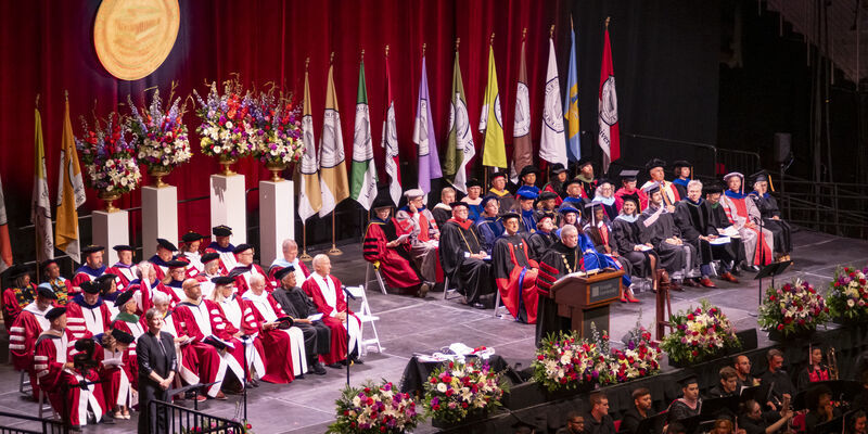 President Fry speaking at podium during Commencement