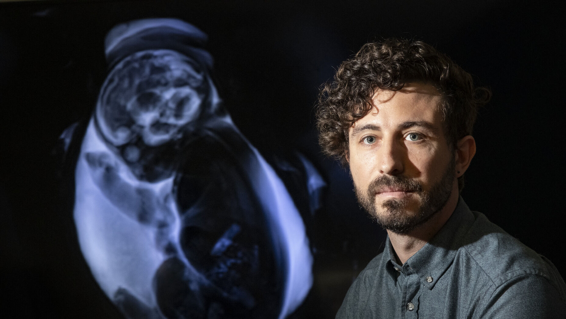 Vlad Ayzenberg next to a baby scan