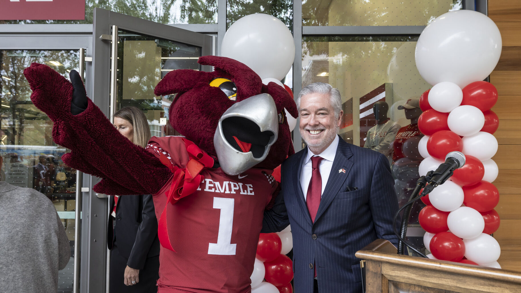 President Fry poses with Hooter the Owl mascot at bookstore grand opening