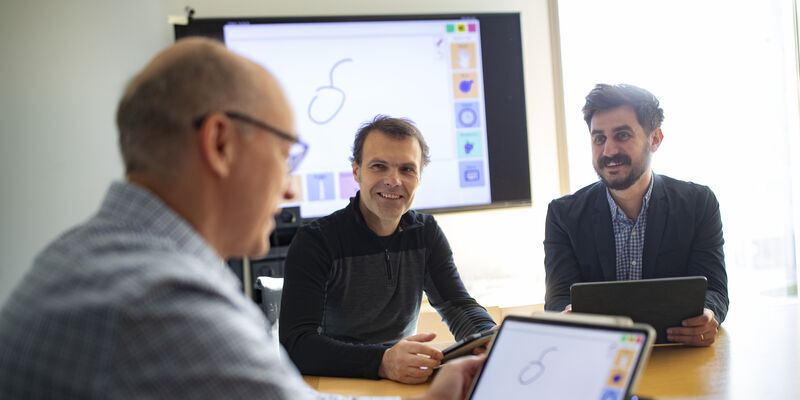 Image of Slobodan Vucetic, Eduard Dragut and Stephen MacNeil with one of their AAC devices.