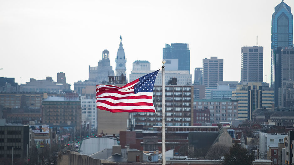 American flag against Philadelphia skyline