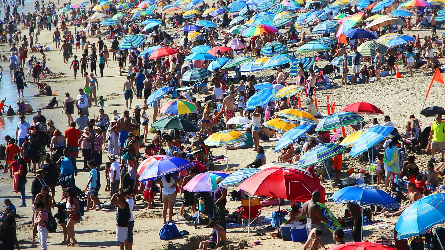 Crowded beach pictured.