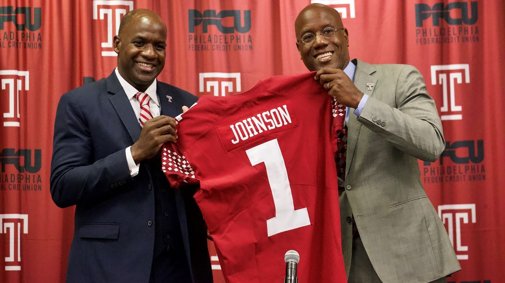 Arthur Johnson pictured with President Wingard, holding Johnson's replica Temple jersey.