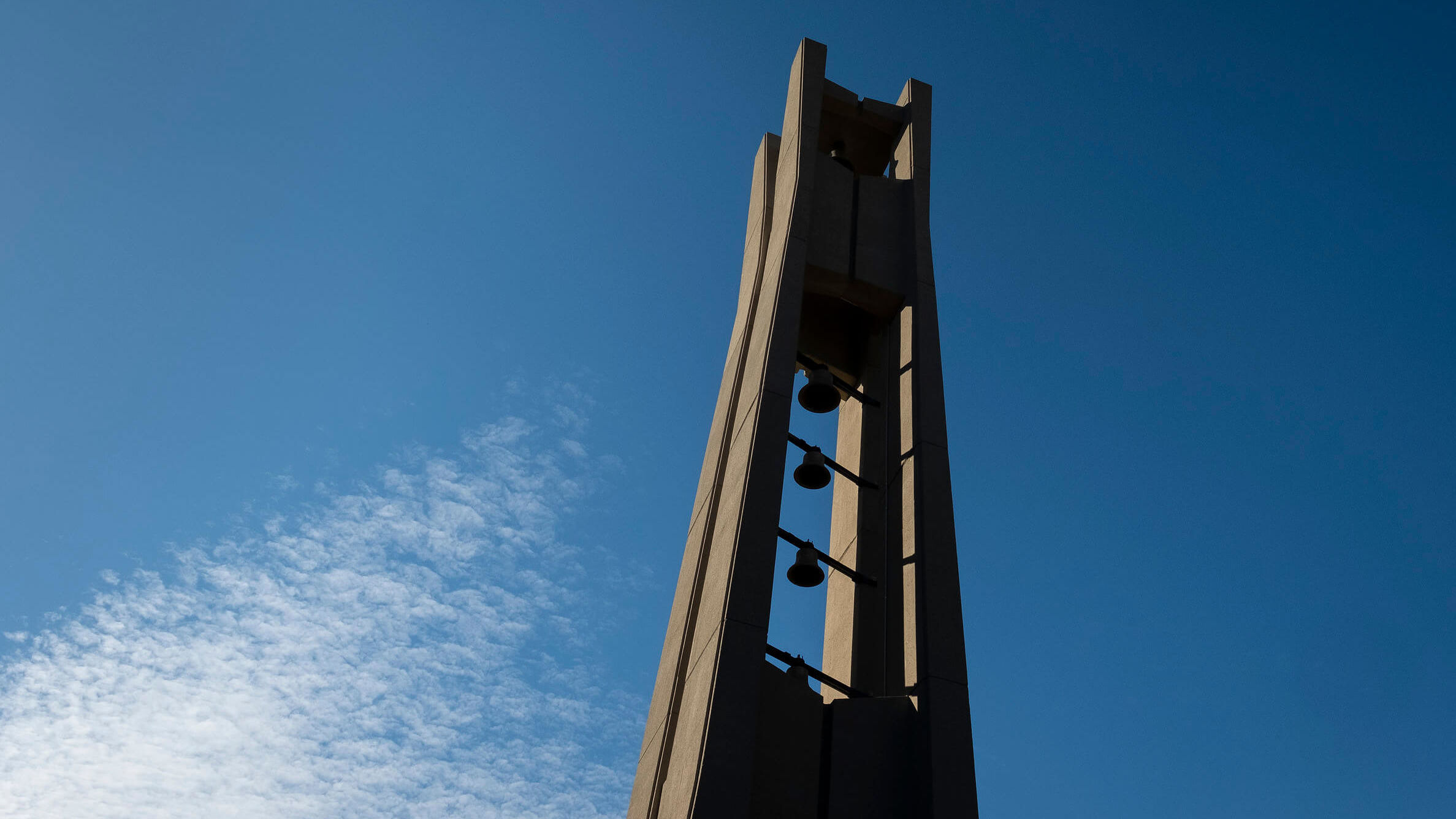 the Bell Tower rising toward a blue sky