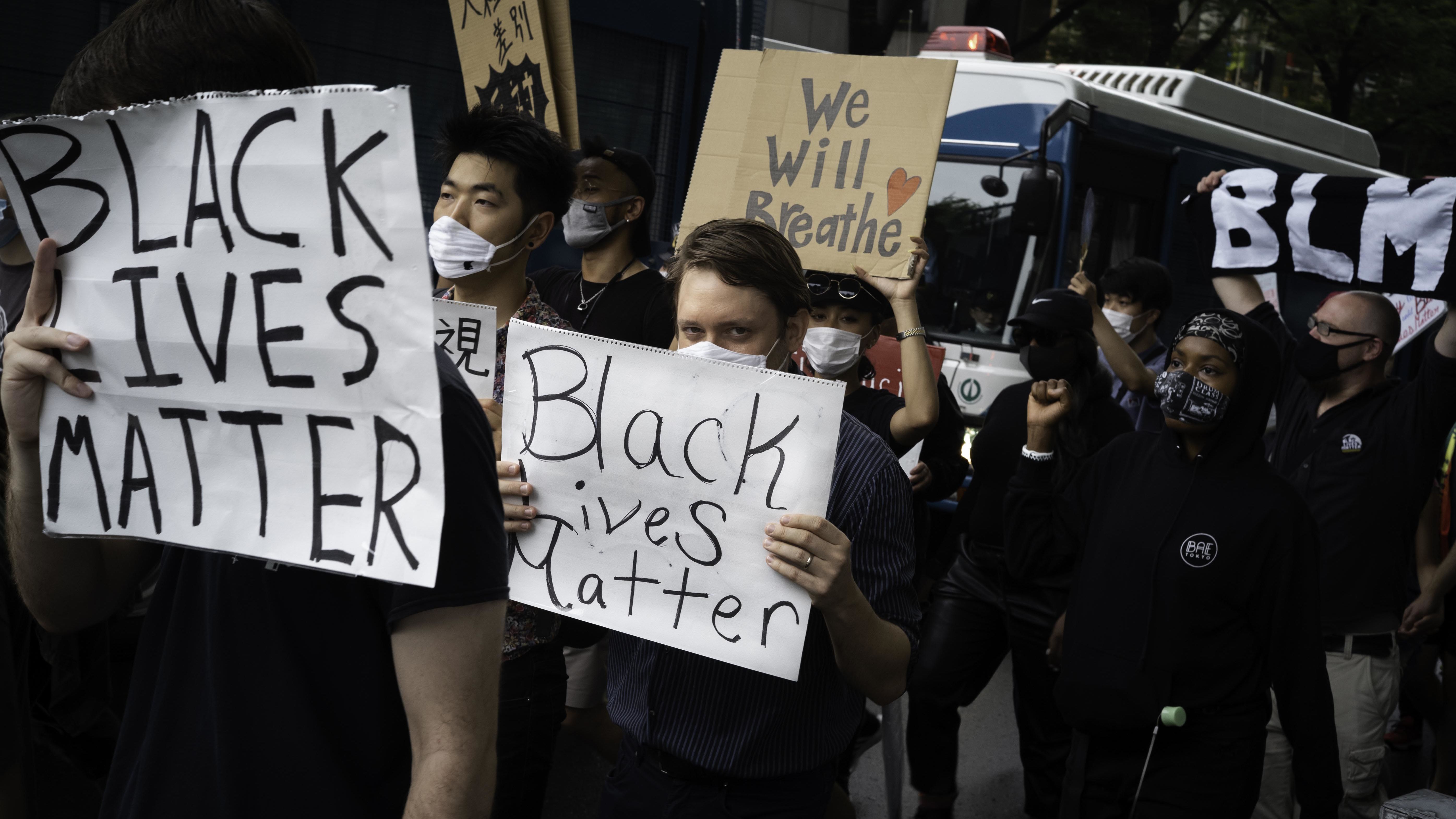 protesters marching in Tokyo