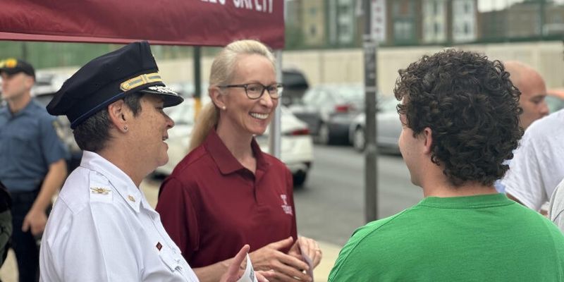 Image of Vice President of Public Safey Jennifer Griffin (center) and Executive Deputy Operations Denise Wilhelm speak with students at the Welcome Wagon on Tuesday